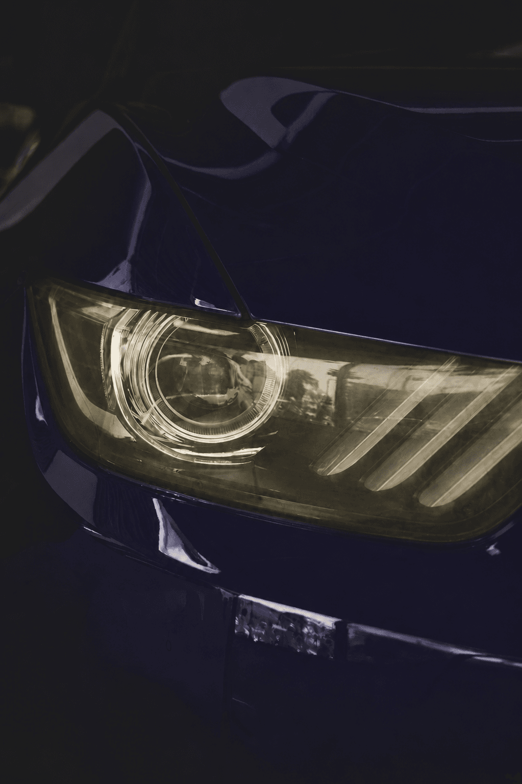Before restoration, yellowed and foggy headlight lens